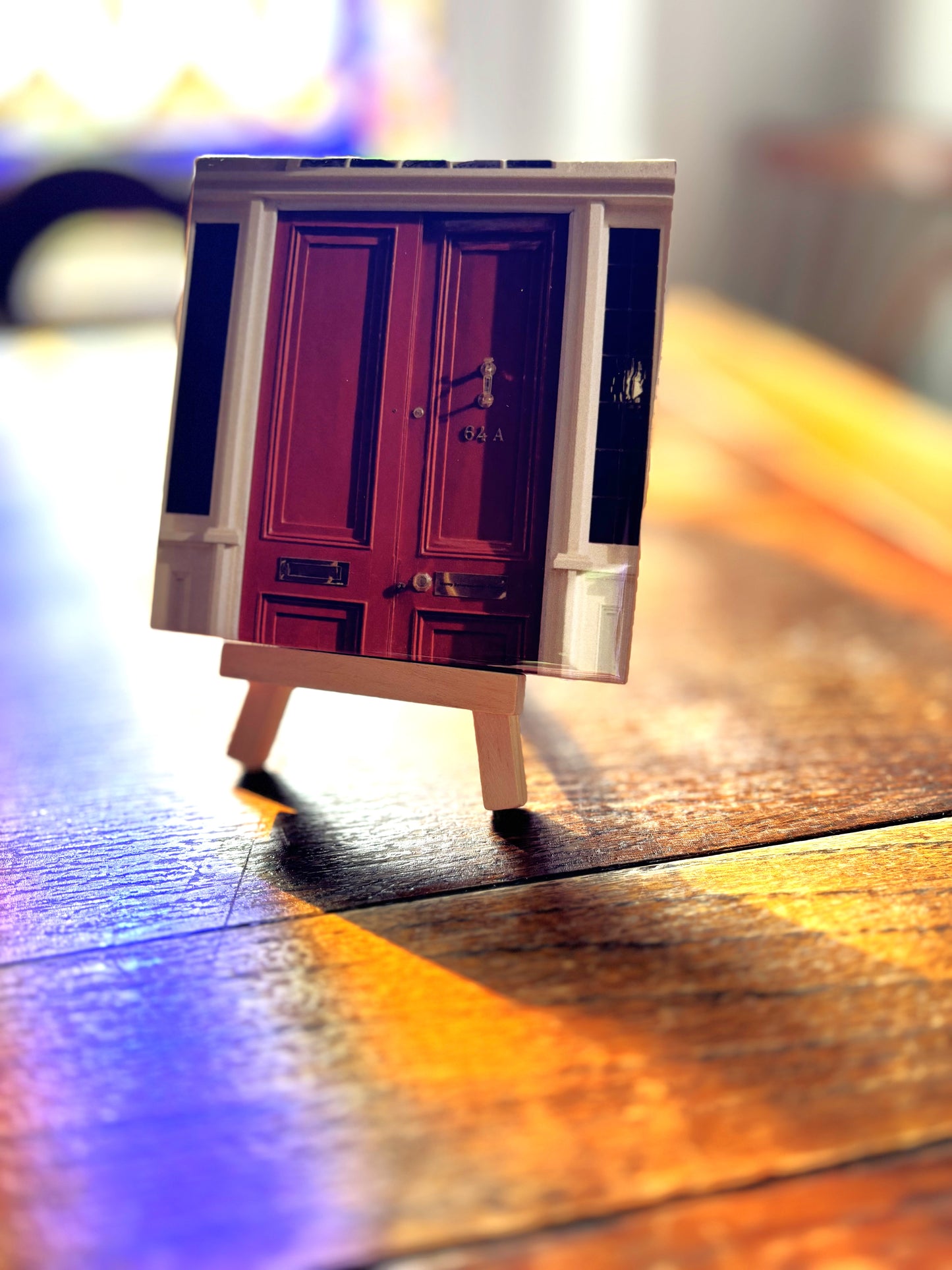 Tile with a small wooden easel stand